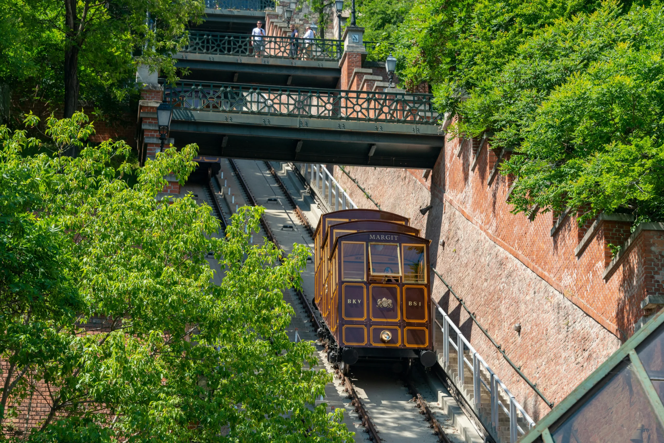 Castle Hill Funicular in Budapest with the “Margit” cabin ascending between green trees
