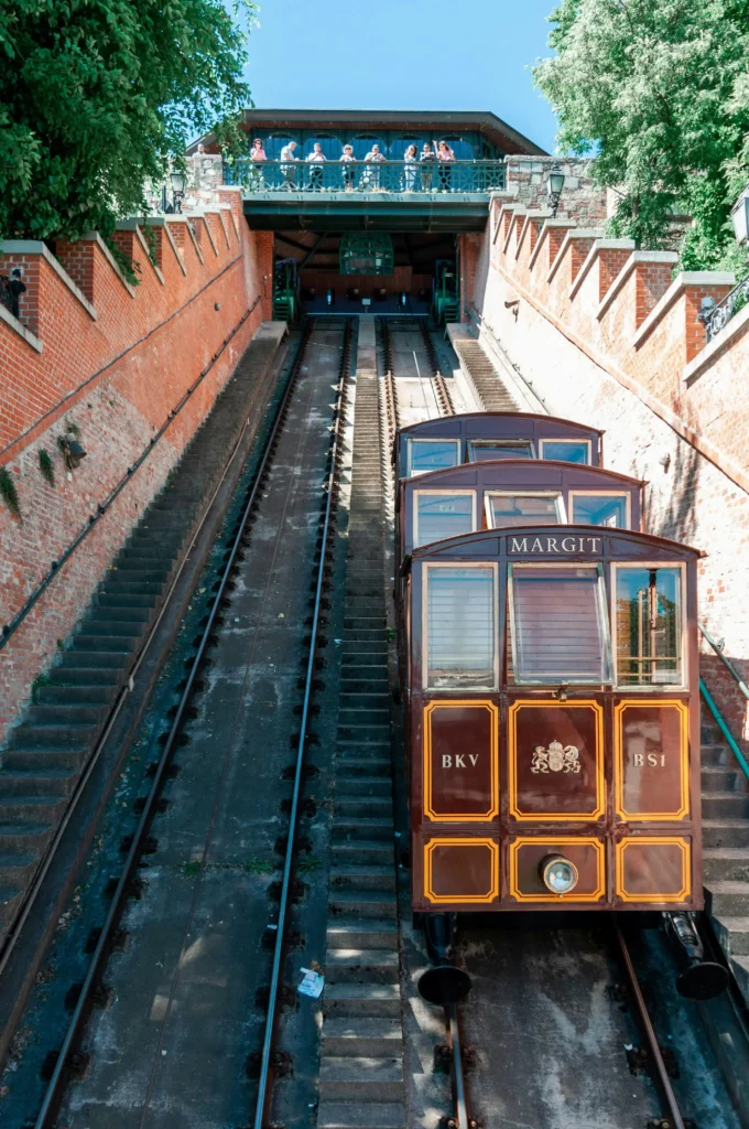 View of the Budapest Castle Hill Funicular from the base, with cars and upper station in sight