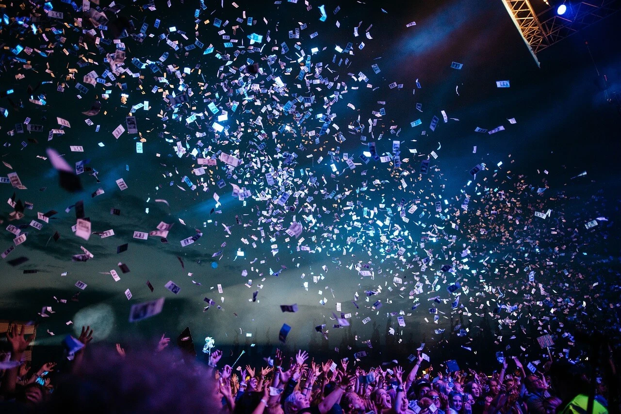 Colorful confetti raining over a cheering crowd at a Hungarian music festival.