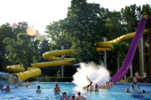 Water slides and outdoor pool at Római Bath in Budapest during summer