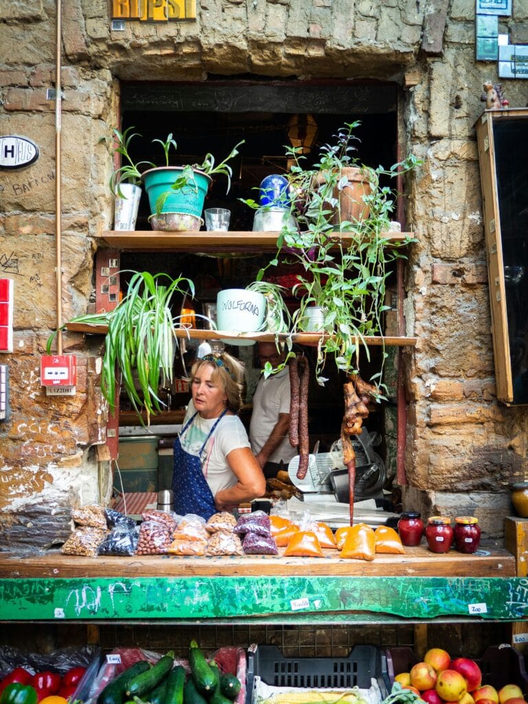 Szimpla Market Budapest with local vendor selling food, spices, and fresh produce