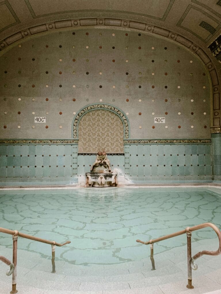 Interior of Rudas Thermal Bath in Budapest, showing the warm 40°C Turkish pool with historic design.