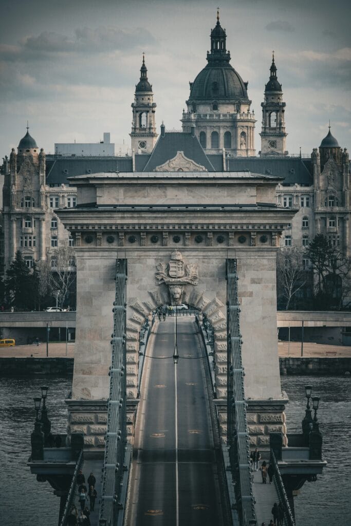 The Chain Bridge in Budapest during the day with St. Stephen’s Basilica in the background