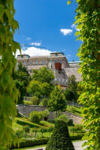 Gardens of Várkert Bazár with Buda Castle rising above Castle Hill in Budapest