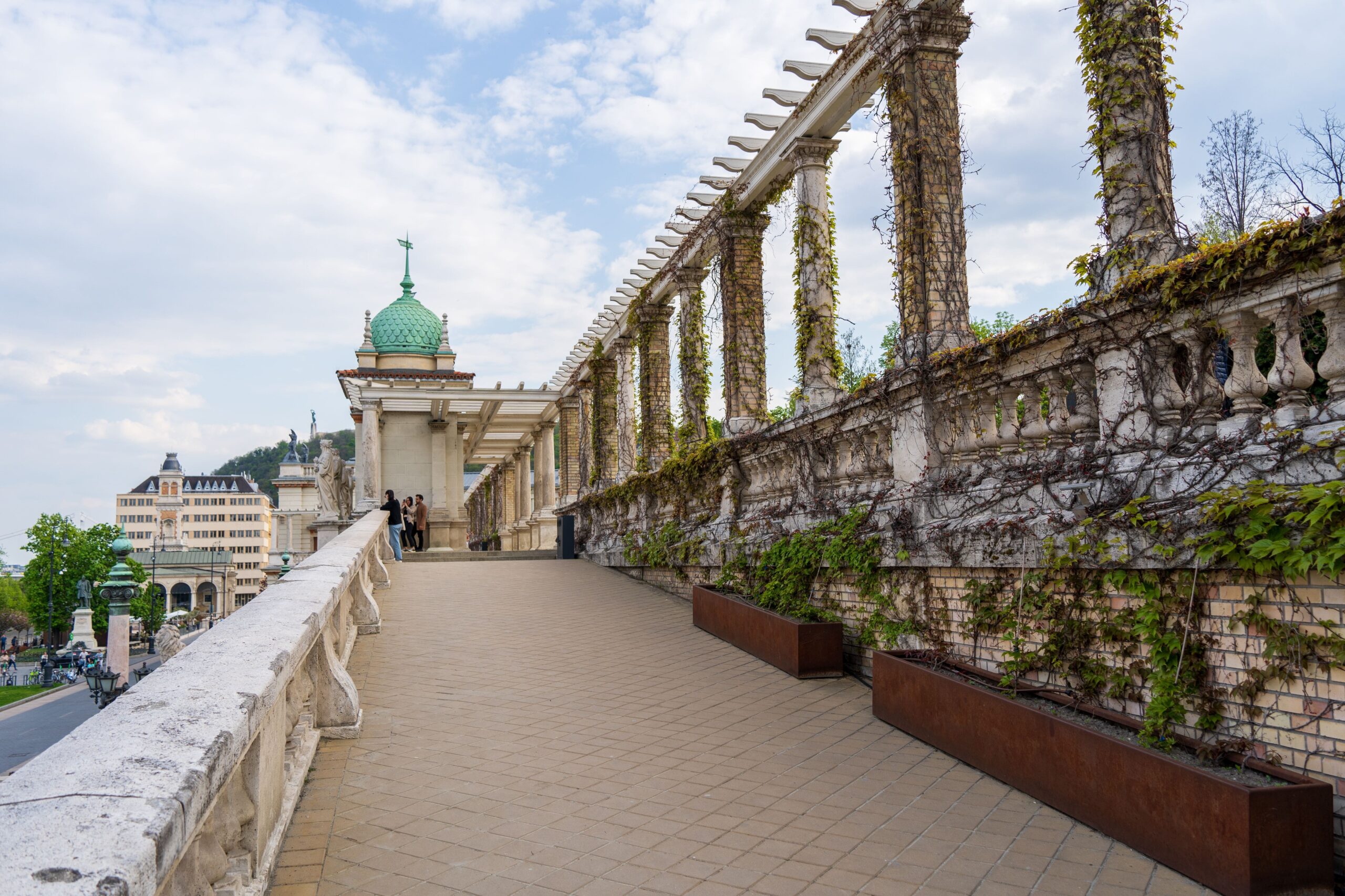 Upper terrace walkway of Várkert Bazár with panoramic views and historic pergolas in Budapest